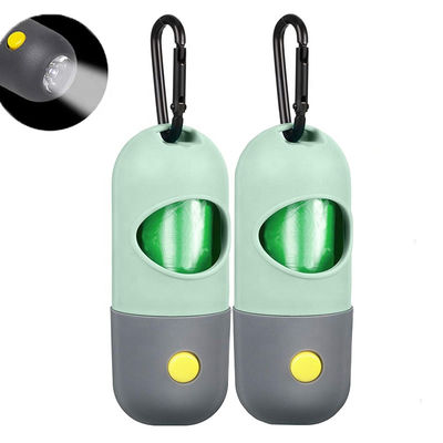 O comprimido dá forma ao distribuidor do suporte do saco do desperdício do cão do tombadilho do animal de estimação da lanterna elétrica do diodo emissor de luz